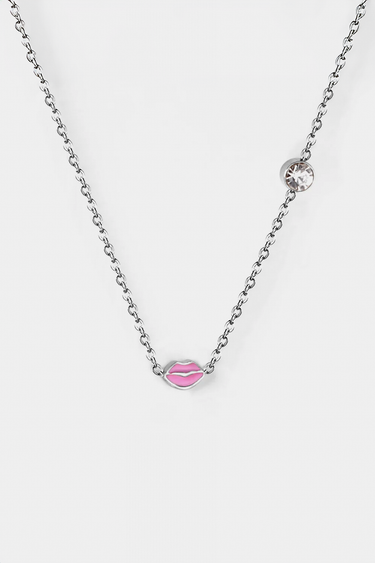 silver chain necklace with a pink lips charm and a round clear crystal accent