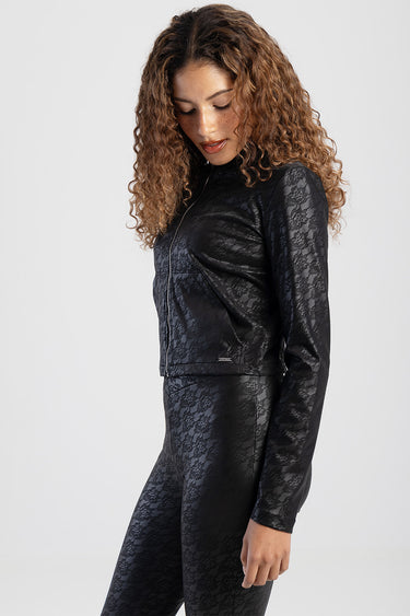 woman wearing a black lace zip jacket with matching lace leggings by blue jean traders