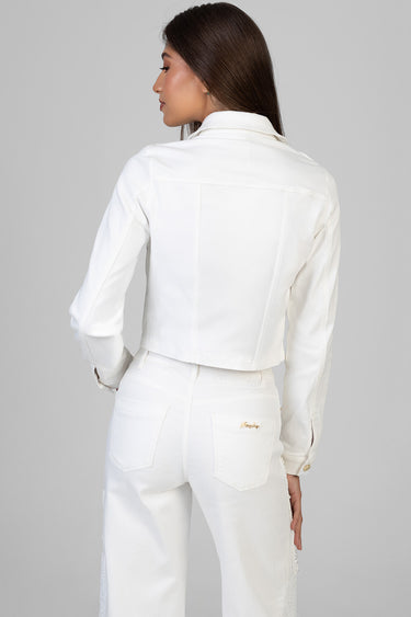 woman in white cropped denim jacket and white jeans from the back, showing back seams and pocket details