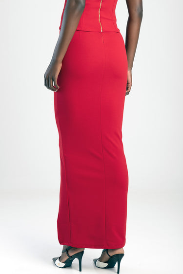 back view of a bright red maxi skirt worn by a model, full length, from Blue Jean Traders, with dark heeled sandals