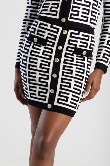 Blue Jean Traders black and white geometric knit skirt with gold buttons down the front