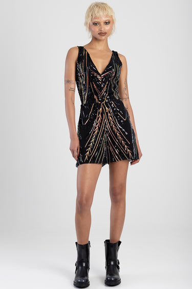 black sequin playsuit with multicolor flame pattern, sleeveless with a deep V neck, short length, model wearing black ankle