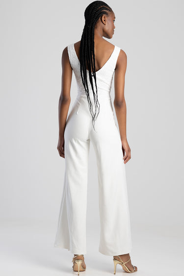 woman wearing white lace top jumpsuit with wide leg pants back view beige heeled sandals