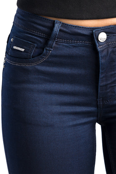 blue skinny jeans by Blue Jean Traders close up of waistband and front pocket with silver button and stitching