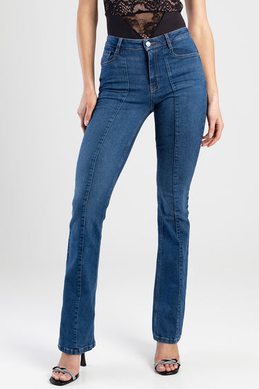 woman wearing blue denim jeans with high rise waist, orange stitching, front pockets and straight leg