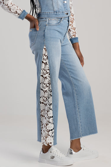 light blue wide leg jeans with a white lace side panel by BLUE JEAN TRADERS, frayed hem, worn with white sneakers