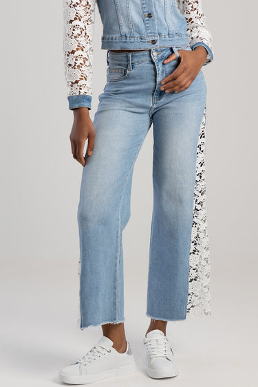 blue wide leg jeans with lace side panels, light wash, cropped frayed hem, worn with white sneakers