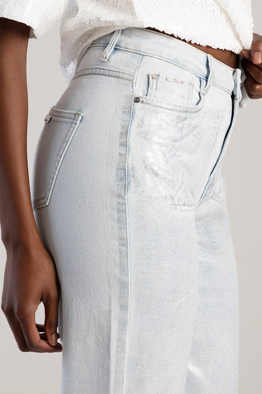 Blue Jean Traders light wash wide leg jeans with fading on the thigh, front pockets and belt loops, paired with a white