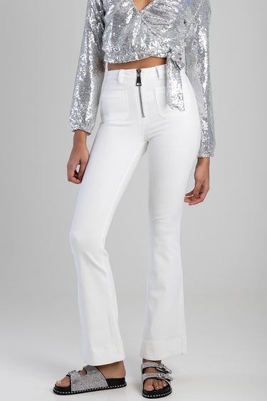 white high waisted jeans with a front metal zipper and belt loops; wide leg flare, paired with a silver sequined top