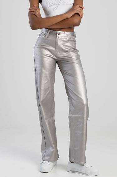 metallic silver trousers with front pockets and belt loops, paired with white sneakers