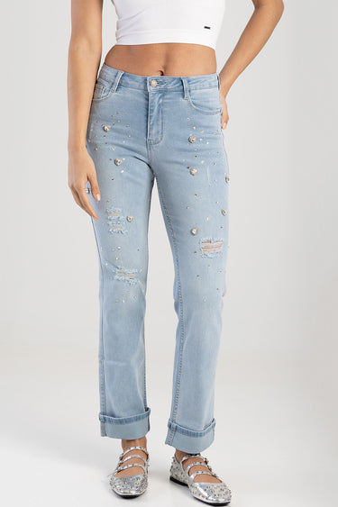 light blue straight jeans with rhinestone embellishments and distressed patches on a model by Blue Jean Traders