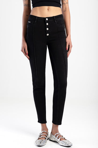woman wearing black skinny jeans with a five button fly, high waist, front pockets, cropped ankle length, silver studded