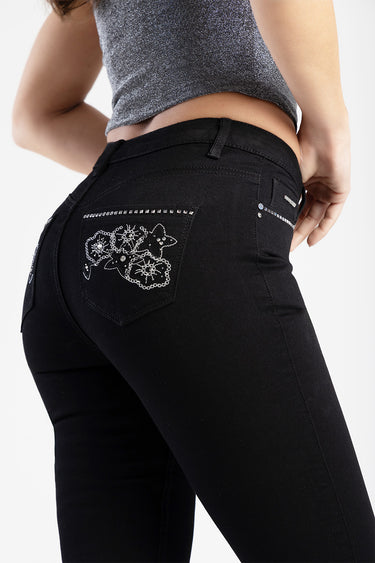 back view of black capri jeans with jeweled floral pocket embroidery and rhinestone accents