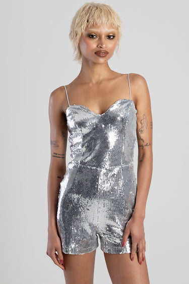 model wearing blue jean traders silver sequined corset playsuit with spaghetti straps
