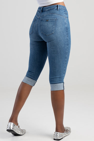 back view of blue capri jeans with rolled cuffs and a rear pocket