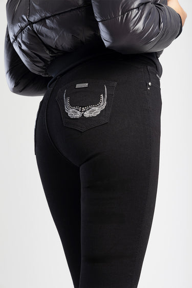 back view of black skinny jeans with silver wing embroidery on the rear pocket by Blue Jean Traders