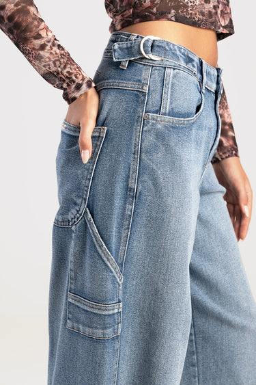 light blue wide leg jeans with belt and side cargo pocket, close up at waist and hip
