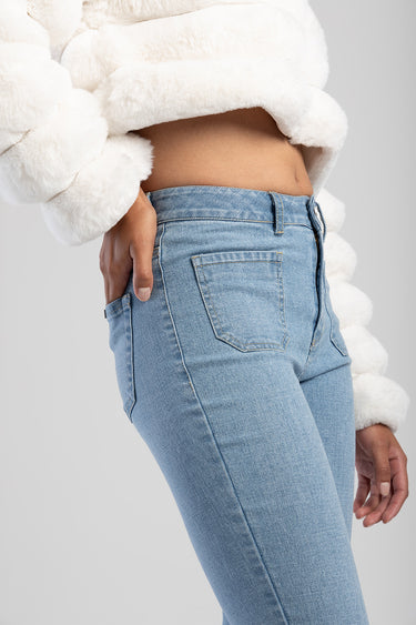 Blue Jean Traders light blue skinny flare jeans shown in a side view with back pocket and belt loops