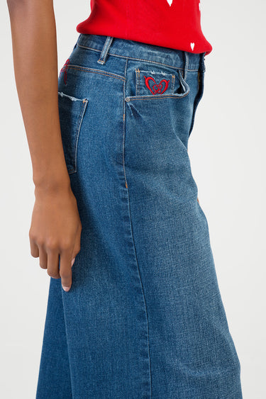 blue jean traders wide leg jeans with red heart embroidery on the back pocket worn by a model