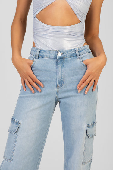 light blue wide leg jeans with cargo pockets and a metal button, paired with a silver twist front top