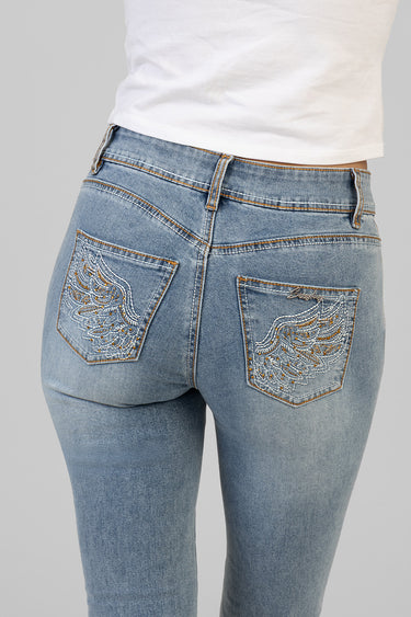 back view of light wash blue jeans with wing embroidery on the rear pockets and a small logo on the right pocket