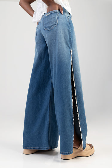 light blue denim wide leg jeans with a pearl trimmed side slit zipper and rear pockets