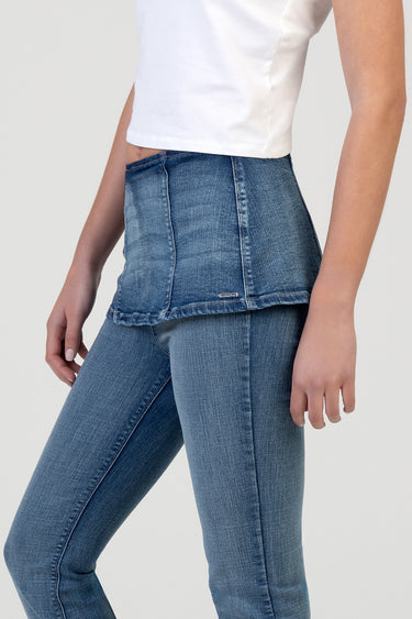 blue jean traders denim jeans with a layered peplum over the hips and a white cropped top