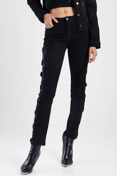 black straight jeans with floral lace trim along the outer legs, mid rise, worn with black ankle boots