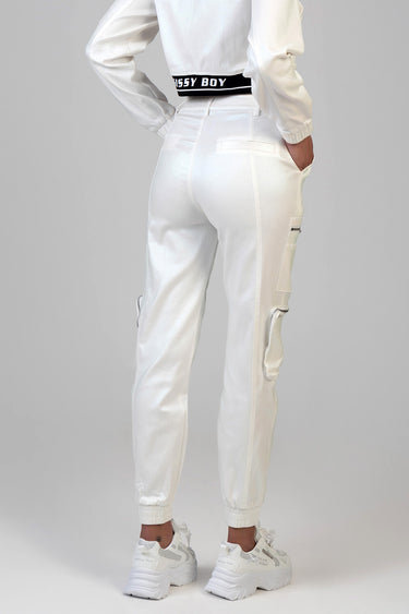 back view of white track pants with cargo pockets and ribbed cuffs, a black waistband reading Missy Boy, paired with white
