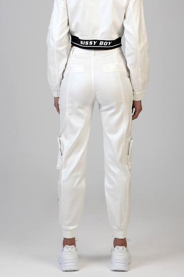 back view of white cargo pants with zip pockets and cuffed ankles, matching white sneakers and a black elastic waistband