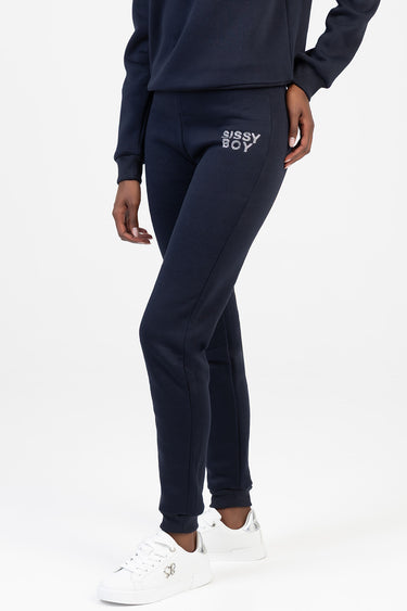 navy joggers with a small white sissy boy logo on the hip, paired with a navy sweatshirt and white sneakers