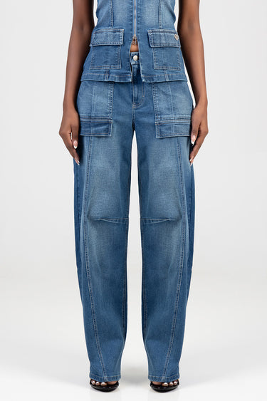 woman in blue denim cargo jeans with large front pockets and wide legs