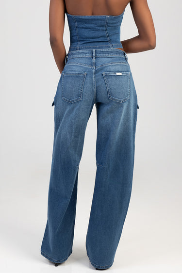 back view of blue denim wide leg jeans with high waist and patch pockets