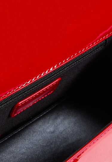 blue jean traders red crossbody bag interior with black lining and red stitching