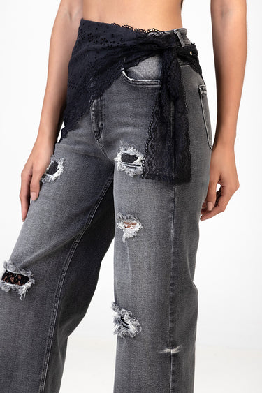 black lace waist wrap tied at the front over distressed grey denim jeans