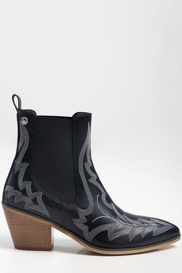 black leather ankle boot with white western stitching and a wooden stacked heel