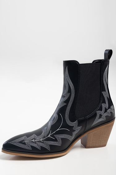 Blue Jean Traders black leather ankle boot with white decorative stitching, elastic side panels, and a chunky wooden heel