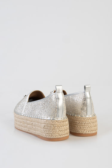 Blue Jean Traders espadrille flats with a silver metallic upper and woven jute sole, back view of a pair