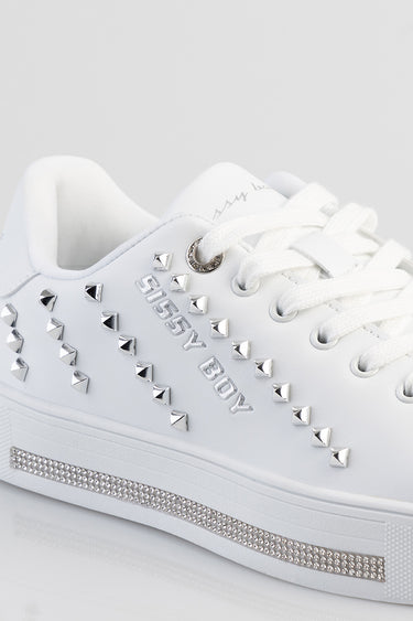 white sneakers with silver pyramid studs along the sides and a rhinestone stripe on the midsole, lace up with white laces