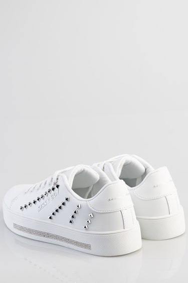 white leather sneakers by Blue Jean Traders with silver pyramid studs along the sides and a rhinestone stripe on the midsole