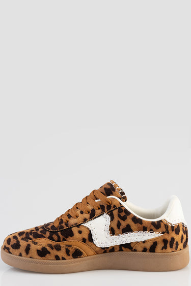 leopard print sneaker with white stitched side panel, tan laces and gum sole visible in profile