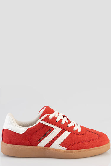 red suede sneakers with white stripes and gum sole, side view