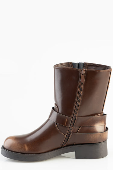 brown leather mid calf boot with a side zipper and ankle strap and chunky black sole