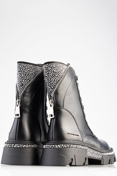 black leather ankle boots with silver rhinestone trim and a chunky sole, rear view with zippers visible