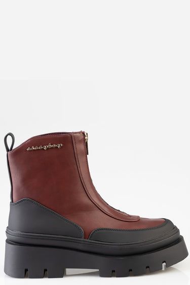 burgundy leather ankle boot with thick black lug sole and back pull tab