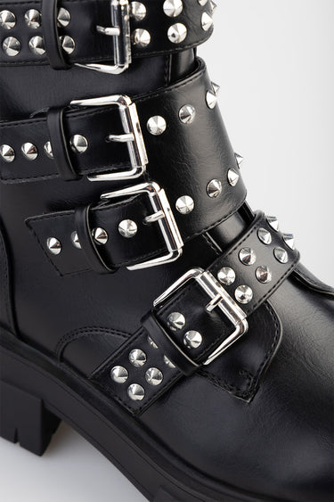black leather ankle boots with multiple silver studded straps and metal buckles