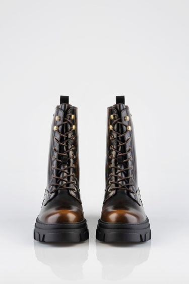 brown and black leather combat boots with brass eyelets and dark brown laces, chunky rubber sole, front view
