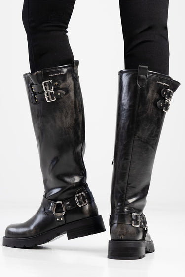black knee high leather boots with multiple silver buckles and strap accents