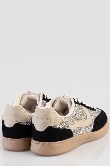 beige and black glitter sneakers with suede panels and a tan rubber sole viewed from the back