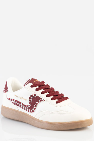 white sneakers with maroon overlays, stitched detailing along the side, and a tan gum sole